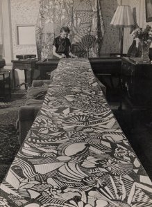 Madge Gill drawing on a roll of fabric!  Love it.