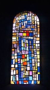 One of Roger Bissiere's stain-glass window designs in Cornol.