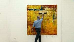 Artist Gerhard Richter at work, as seen in Corinna BelzÕs documentary GERHARD RICHTER PAINTING.  Courtesy of Kino Lorber.